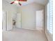 Bedroom with neutral walls and carpet, and views to the stairway and walk-in closet at 1160 Newpark View Pl # 8, Mableton, GA 30126