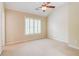 Neutral bedroom with vaulted ceiling, fan, and shuttered window at 1160 Newpark View Pl # 8, Mableton, GA 30126