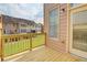 Back deck with a wooden railing and view of the lawn at 1160 Newpark View Pl # 8, Mableton, GA 30126