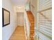 Inviting entryway with hardwood floors and staircase with wooden trim at 1160 Newpark View Pl # 8, Mableton, GA 30126