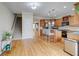 Open concept kitchen with hardwood floors, stainless steel appliances, and natural light at 1160 Newpark View Pl # 8, Mableton, GA 30126
