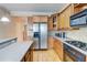 Modern kitchen features a center island, stainless steel appliances, and hardwood floors at 1160 Newpark View Pl # 8, Mableton, GA 30126