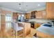 Well-lit kitchen featuring an island with seating, stainless steel appliances, and hardwood floors at 1160 Newpark View Pl # 8, Mableton, GA 30126