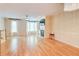 Bright living room with hardwood floors, fireplace, and modern chandelier lighting at 1160 Newpark View Pl # 8, Mableton, GA 30126