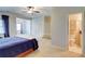 Spacious main bedroom with seating area and adjoining bathroom at 1160 Newpark View Pl # 8, Mableton, GA 30126