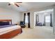 Large main bedroom including a seating area with plush carpet at 1160 Newpark View Pl # 8, Mableton, GA 30126