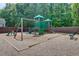 Community playground featuring a wooden playset, mulch, and a small bench at 1160 Newpark View Pl # 8, Mableton, GA 30126