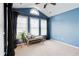 Bright sitting room with blue walls, curtains, windows and a cushioned bench at 1160 Newpark View Pl # 8, Mableton, GA 30126