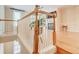 Open staircase featuring wooden railing with white trim, leading to the living room at 1160 Newpark View Pl # 8, Mableton, GA 30126