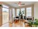 Bright sunroom with hardwood floors, ceiling fan, and a door to a private deck at 1160 Newpark View Pl # 8, Mableton, GA 30126