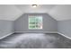 Upstairs bedroom with vaulted ceilings and window at 140 Heritage Ct, Fayetteville, GA 30214