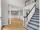 Inviting foyer with staircase, hardwood floors, and elegant chandelier at 140 Heritage Ct, Fayetteville, GA 30214