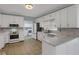 Bright kitchen with stainless appliances, granite countertops, and tile backsplash at 140 Heritage Ct, Fayetteville, GA 30214