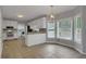 Eat-in kitchen featuring white cabinets, breakfast area and lots of natural light at 140 Heritage Ct, Fayetteville, GA 30214