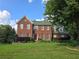 Beautiful two-story brick home with a well-manicured front yard and a classic design at 2209 Willow Crest Cir, Lawrenceville, GA 30044