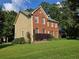 Charming two-story home featuring a brick facade and lush green lawn at 2209 Willow Crest Cir, Lawrenceville, GA 30044