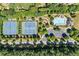 Aerial view of neighborhood amenities including tennis courts, playground, and a community pool at 3843 Dragon Fly Ln, Loganville, GA 30052