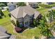 Spacious house with stone and siding exterior, fenced yard, and well-kept landscaping at 3843 Dragon Fly Ln, Loganville, GA 30052