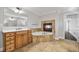 Bathroom features a fireplace over the jetted tub, vanity, and tile floors at 3843 Dragon Fly Ln, Loganville, GA 30052