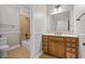 Bathroom includes a single vanity and a shower and tub combination with tan tiling surround at 3843 Dragon Fly Ln, Loganville, GA 30052