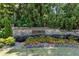 Ozora Lake entrance sign surrounded by landscaping and foliage at 3843 Dragon Fly Ln, Loganville, GA 30052