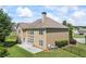 Inviting two-story home featuring a well-manicured lawn and a spacious concrete patio at 3843 Dragon Fly Ln, Loganville, GA 30052