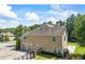 Lovely home showcasing a three-car garage and a sprawling driveway at 3843 Dragon Fly Ln, Loganville, GA 30052