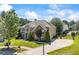 Charming home with manicured lawn, stone accents, and mature landscaping at 3843 Dragon Fly Ln, Loganville, GA 30052