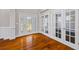 Entryway with hardwood floors, white trim, and french doors at 3843 Dragon Fly Ln, Loganville, GA 30052