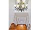 Grand foyer with hardwood floors, large chandelier, and front door at 3843 Dragon Fly Ln, Loganville, GA 30052