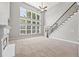 Inviting living room with a fireplace, soaring ceilings, and large windows at 3843 Dragon Fly Ln, Loganville, GA 30052