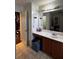 Functional bathroom featuring a single sink vanity, mirror, and adjacent closet space at 4018 Carisbrook Dr, Union City, GA 30291