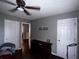 A bedroom offering natural light, ceiling fan, hardwood floor, with multiple entrances at 4018 Carisbrook Dr, Union City, GA 30291