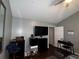 Cozy bedroom featuring modern decor, including black furnishings and a wall-mounted TV at 4018 Carisbrook Dr, Union City, GA 30291