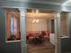 Cozy dining room with elegant chandelier, hardwood floors, and decorative columns at 4018 Carisbrook Dr, Union City, GA 30291