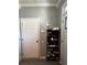 Functional entryway with a shoe rack, security system, and neutral wall color at 4018 Carisbrook Dr, Union City, GA 30291