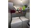 Functional laundry room with washer, dryer, and storage shelves at 4018 Carisbrook Dr, Union City, GA 30291
