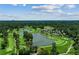 Expansive aerial view of a luxurious golf course with water features and a skyline far off into the distance at 2466 Brookhaven Ne Pl, Brookhaven, GA 30319