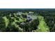 Beautiful aerial view of a lush golf course, with mature trees and serene water features on the green at 2466 Brookhaven Ne Pl, Brookhaven, GA 30319