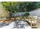 Secluded backyard featuring a bench, mature tree, and a peaceful garden area enclosed by a fence at 2466 Brookhaven Ne Pl, Brookhaven, GA 30319