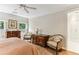 Bedroom featuring windows with shutters, hardwood floors, and antique furnishings at 2466 Brookhaven Ne Pl, Brookhaven, GA 30319