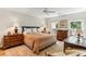 Bedroom with hardwood floors, shuttered windows, and furnished with antique furniture at 2466 Brookhaven Ne Pl, Brookhaven, GA 30319