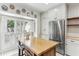 Bright kitchen featuring a butcher block island, stainless steel appliances, and white brick flooring at 2466 Brookhaven Ne Pl, Brookhaven, GA 30319