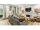 Bright living room features fireplace, built-ins, hardwood floors, and an inviting atmosphere at 2466 Brookhaven Ne Pl, Brookhaven, GA 30319