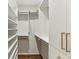 Walk-in closet with custom shelves and drawers for ample storage space at 2466 Brookhaven Ne Pl, Brookhaven, GA 30319