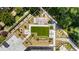 Drone shot of building amenities including an outdoor patio, lawn, pergola and seating areas at 2660 Peachtree Nw Rd # 13F, Atlanta, GA 30305