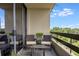 Relaxing balcony view with outdoor seating, a table and a calming potted plant feature at 2660 Peachtree Nw Rd # 13F, Atlanta, GA 30305