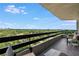 Enjoy lush treetop views from this high-rise balcony featuring modern outdoor furniture at 2660 Peachtree Nw Rd # 13F, Atlanta, GA 30305