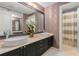 Elegant bathroom with double vessel sinks, modern fixtures, and stylish wallpaper at 2660 Peachtree Nw Rd # 13F, Atlanta, GA 30305