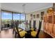 Dining room with city views, a modern light fixture, and a large table for entertaining guests at 2660 Peachtree Nw Rd # 13F, Atlanta, GA 30305